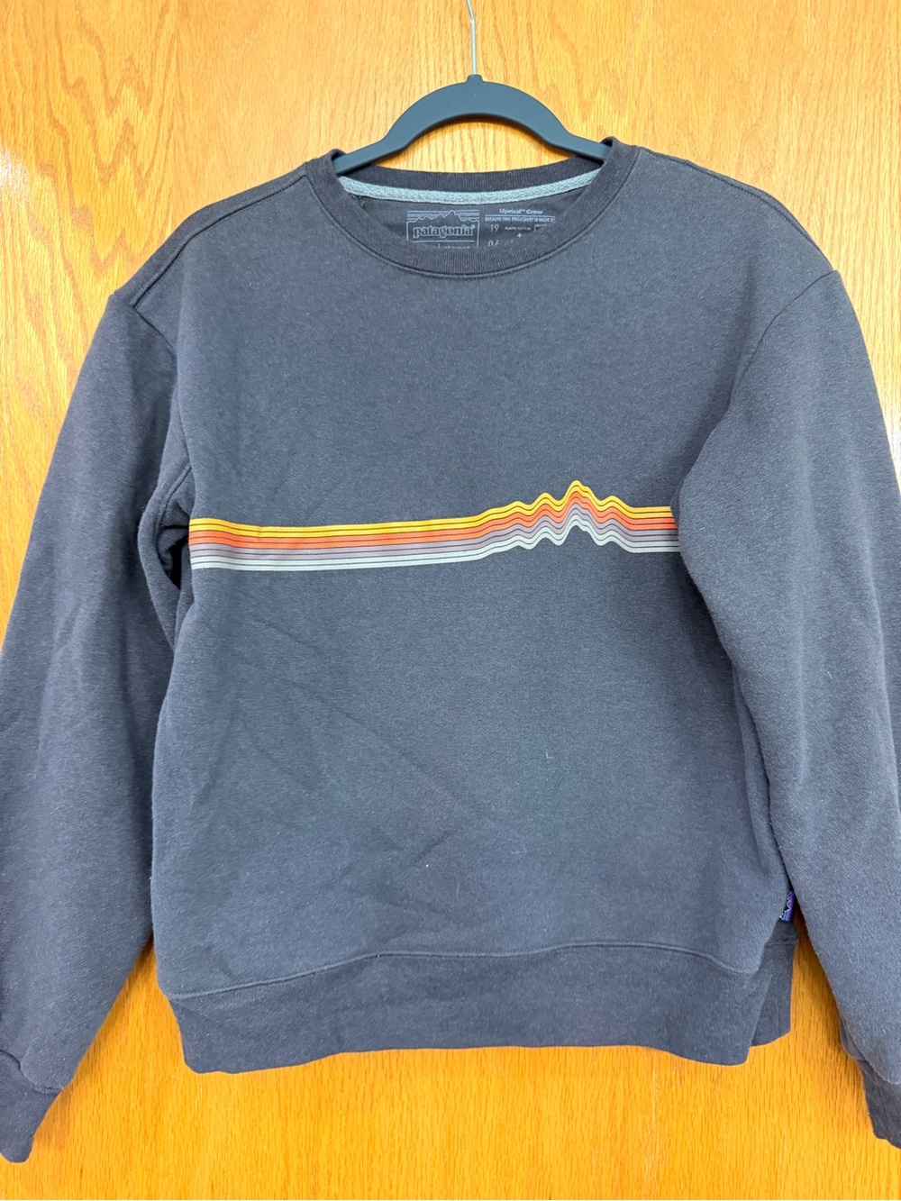 Patagonia Black Crewneck Sweatshirt with Rainbow Chest Stripe